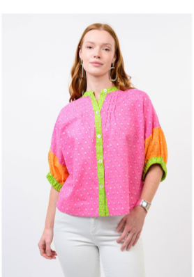 pink top with orange and green and bird pattern 